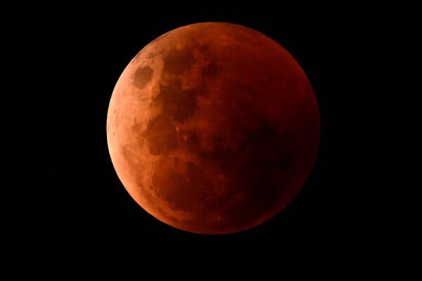 A blood moon in a black sky.