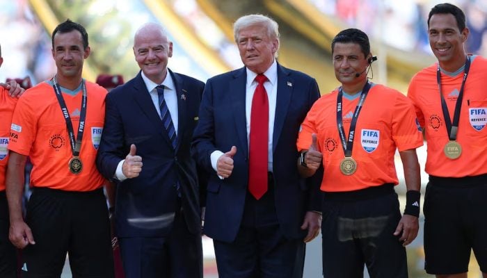 US President Donald Trump and FIFA president Gianni Infantino pose for a photo with referee Alireza Faghani and his assistant referees at the FIFA Club World Cup Final, MetLife Stadium, East Rutherford, New Jersey, US, July 13, 2025. — Reuters