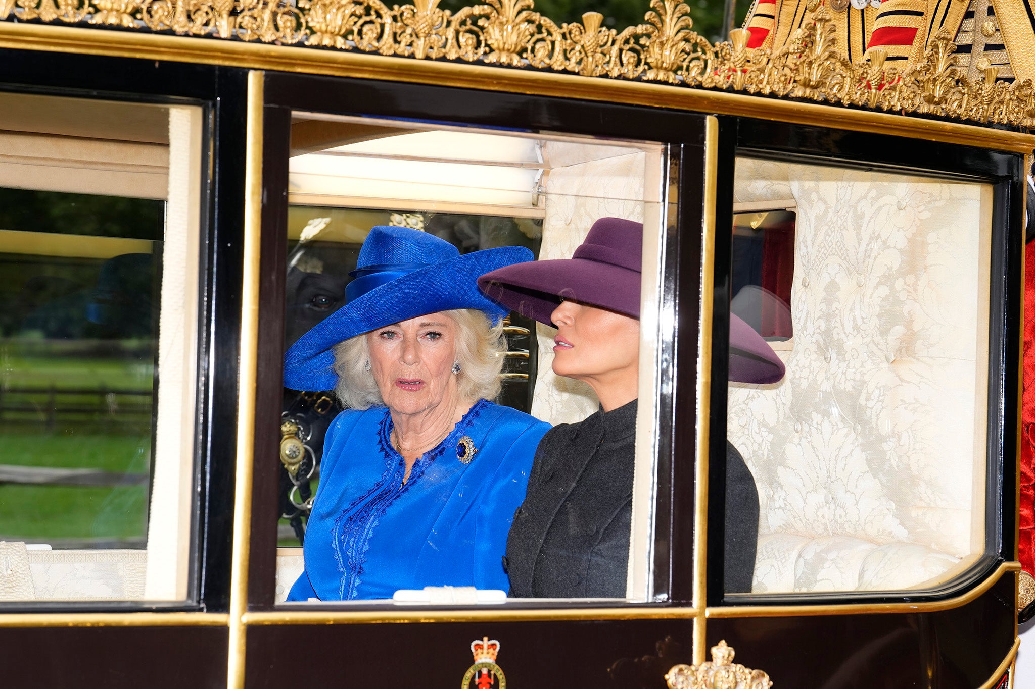 Queen Camilla and First Lady Melania Trump during the carriage procession to Windsor Castle, Berkshire