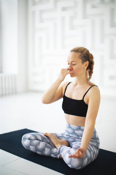 Alternate Nostril Breathing: Sit comfortably with your spine straight. Use your right thumb to close your right nostril. Now inhale deeply through your left nostril. Continue by closing your left nostril with your right ring finger and releasing your right nostril. Inhale and exhale through your right nostril. Repeat this exercise for several cycles. Alternate Nostril Breathing: Sit comfortably with your spine straight. Use your right thumb to close your right nostril. Now inhale deeply through your left nostril. Continue by closing your left nostril with your right ring finger and releasing your right nostril. Inhale and exhale through your right nostril. Repeat this exercise for several cycles.